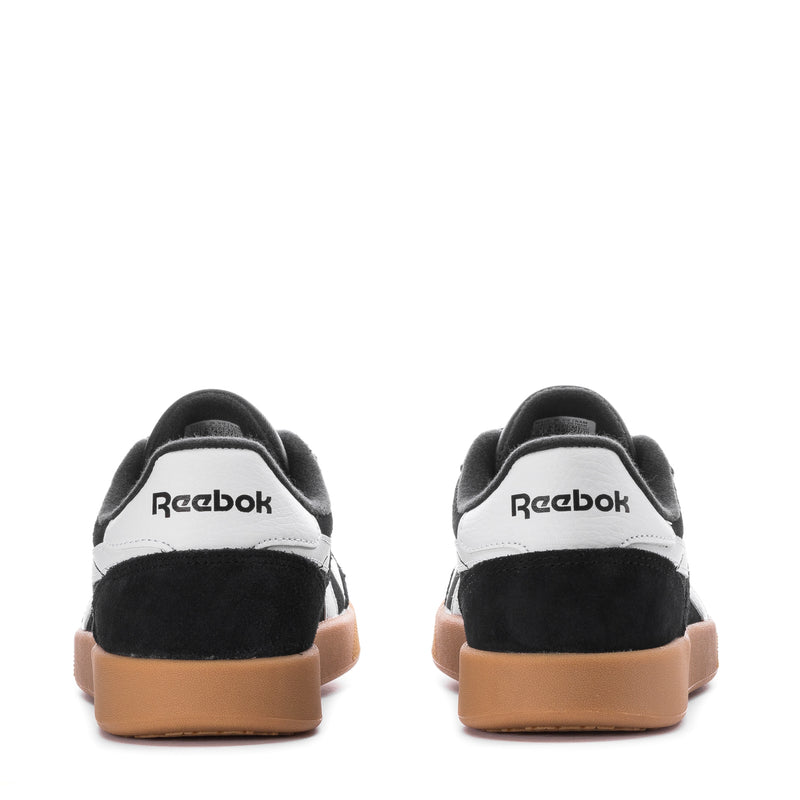 Men's black Reebok sneakers with white heel panel and gum rubber sole
