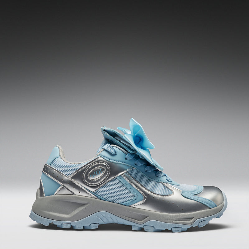 Light blue and silver sneaker on a gradient background