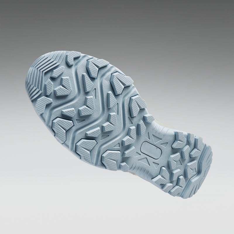 Close-up of a textured shoe sole on a gradient background