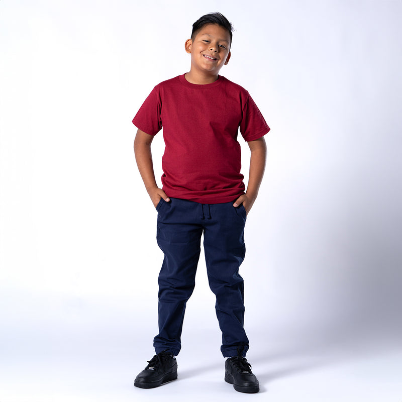Burgundy crew-neck T-shirt with short sleeves, worn by a standing child.