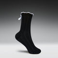 Black sock with white trim on a gray background