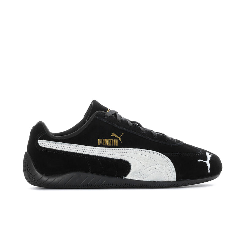 Men's black and white low-top sneakers with Puma logo and lace-up closure