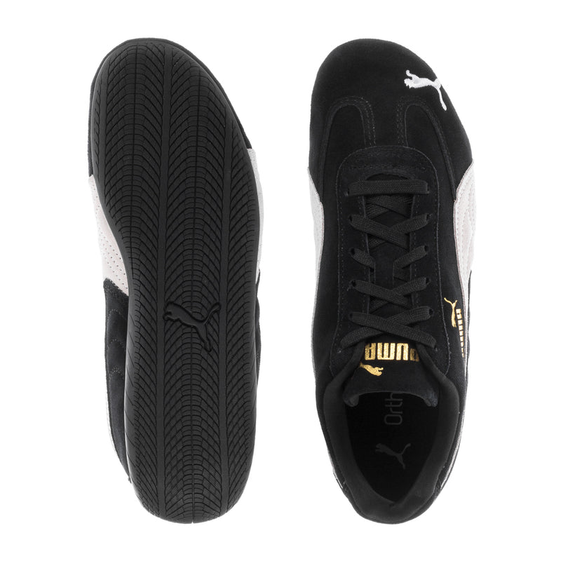 Puma women's low-top sneaker sole and side view, black upper with treaded outsole