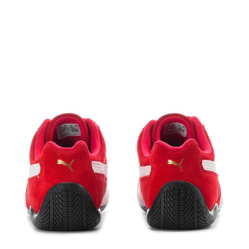 Red and white women's sneakers with heel tabs and textured rubber soles
