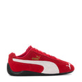 Youth red low-top sneakers with white stripe paneling, PUMA logo, and black outsole