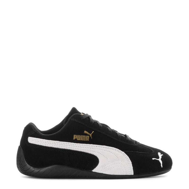 Youth black and white Puma sneakers with white mid-panel and Puma cat logo