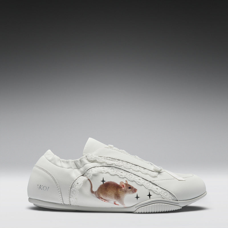 White sneaker with a mouse design on a gray background