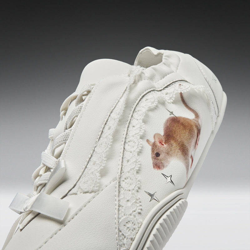 White sneaker with a mouse design on a gradient background