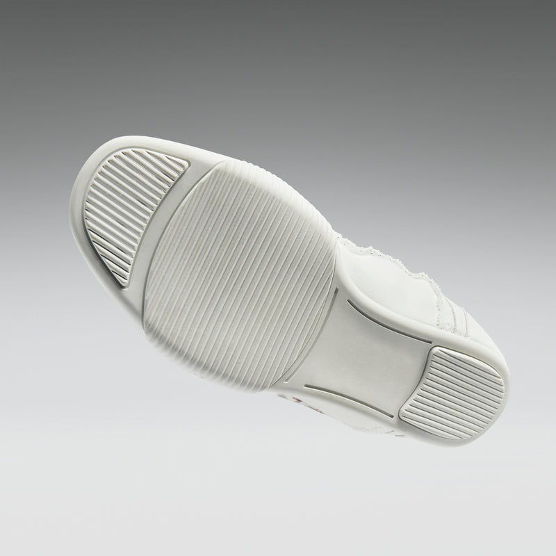 White sneaker with sole detail on a gray background