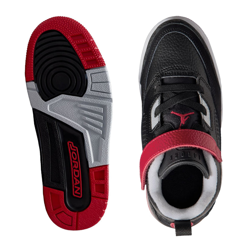 Kids low-top sneaker outsole and heel: black tread with red forefoot panel