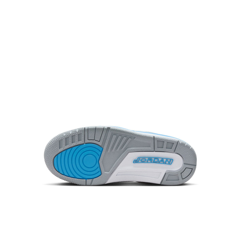 Kids low-top sneaker outsole view, grey tread with blue circular traction