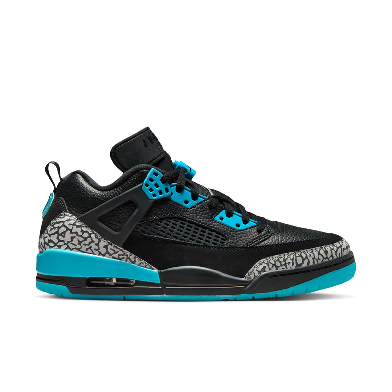 Men's low-top sneakers in black with turquoise accents and speckled panel.
