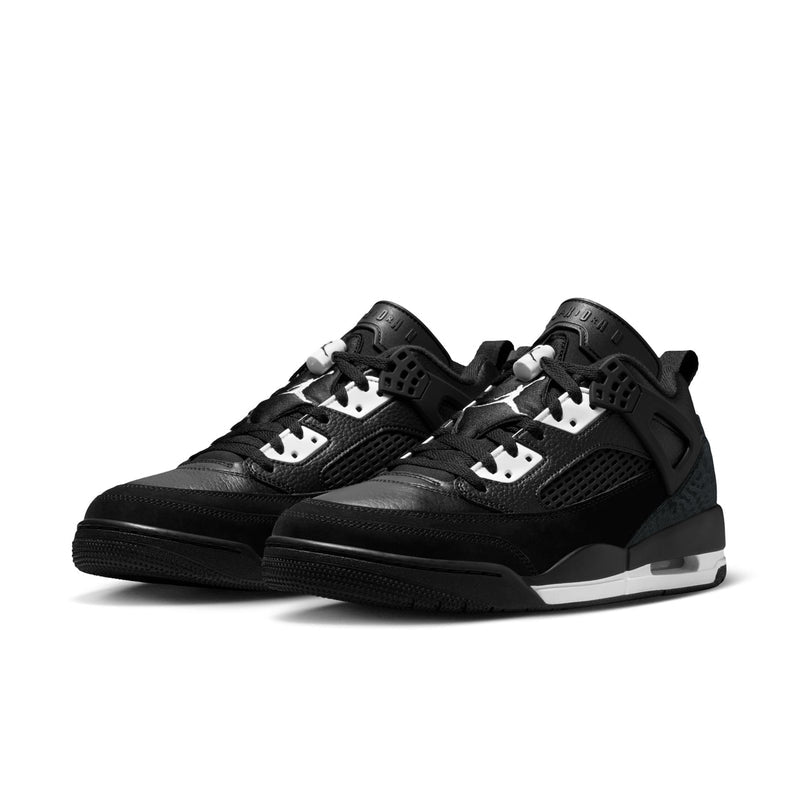 Pair of men's black low-top sneakers, angled view showing side profiles and midsole.