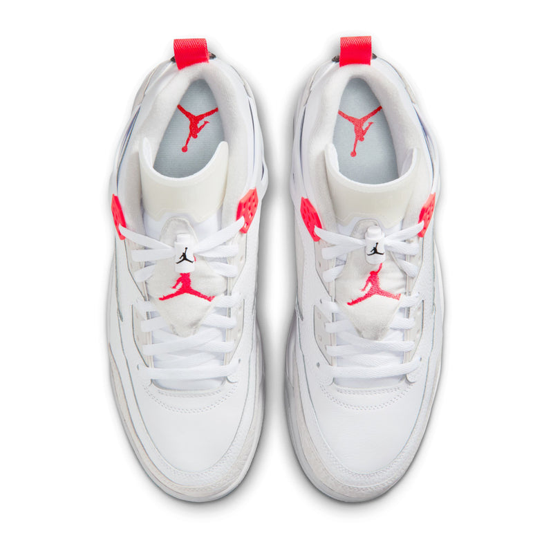 White sneakers with red Jumpman logo on tongues and uppers, lace-up front view