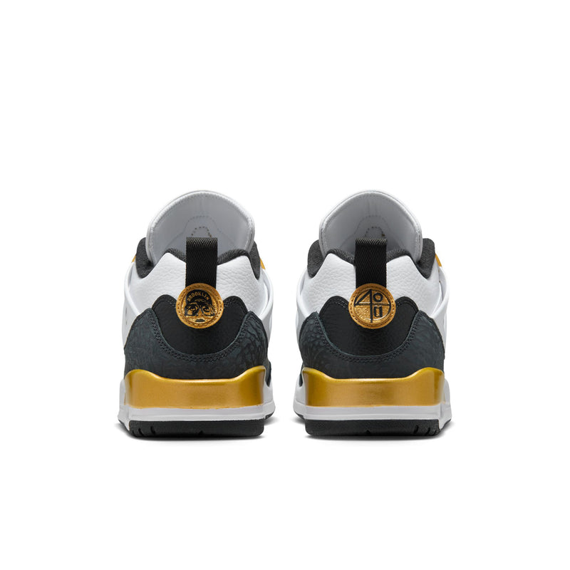 Men's low-top sneakers from the back; black heel with metallic gold lace detail and logo.