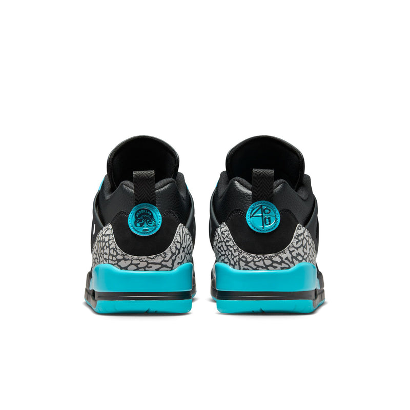 Men's low-top sneakers, black heel with turquoise tab and speckled midsole.