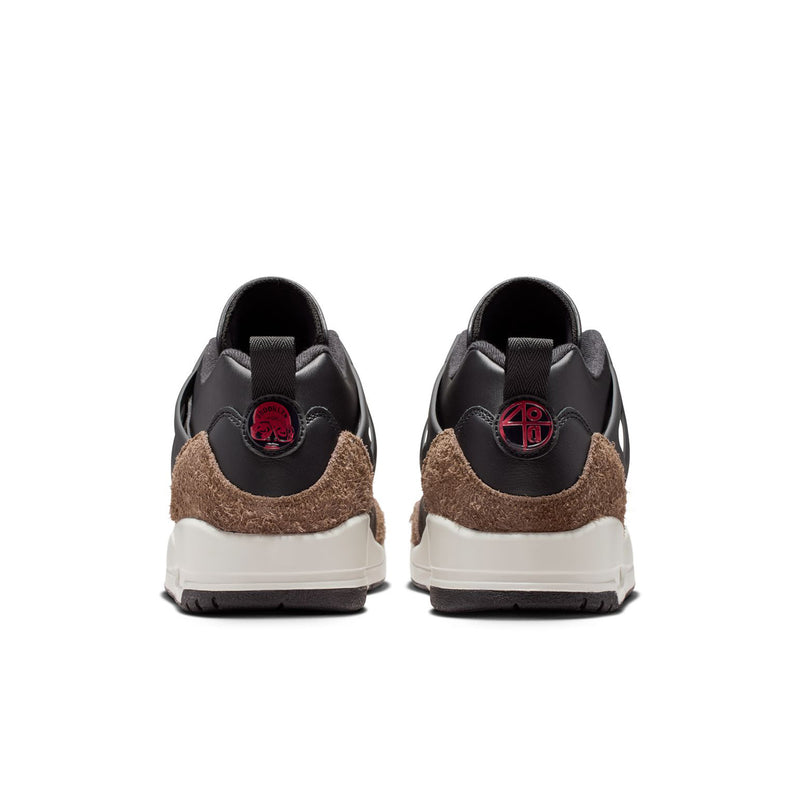 Black sneakers with brown suede heel, contrasting white heel panel, red logo detail