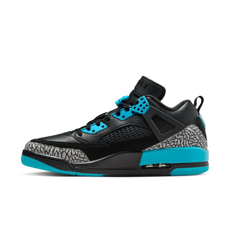Men's low-top sneakers in black with turquoise lace accents and speckled side panel.