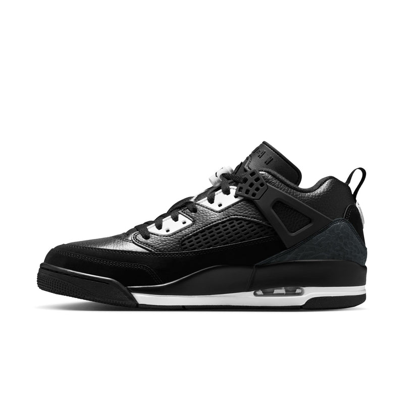 Men's black low-top sneakers with white lace eyelets and contrast midsole.