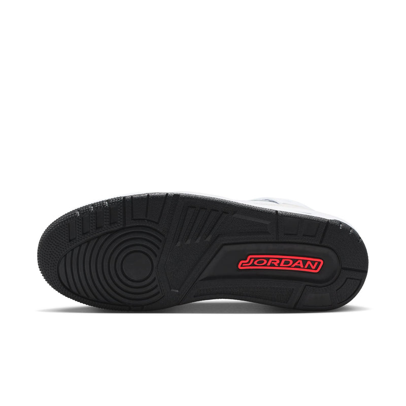 Black rubber outsole with textured tread and red Jordan branding on heel