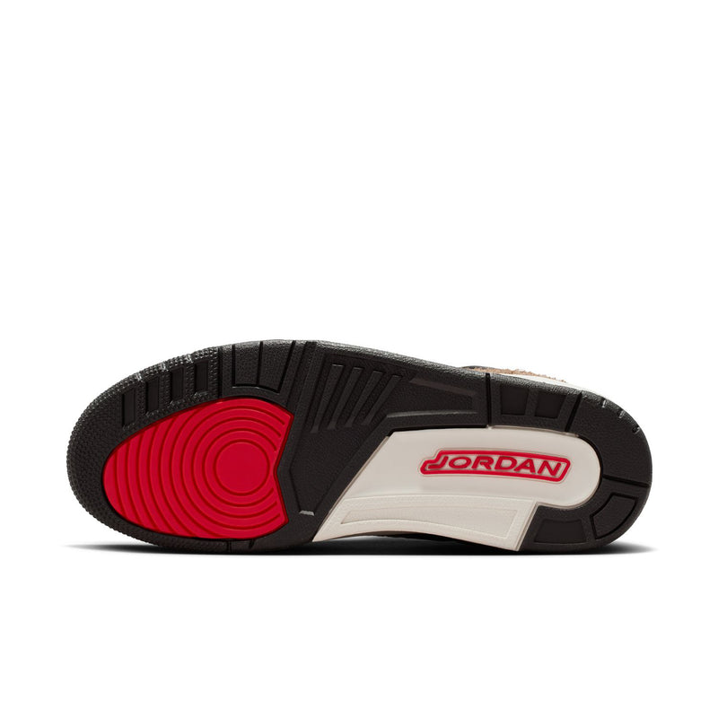 Black rubber outsole with red traction pattern and 'JORDAN' logo