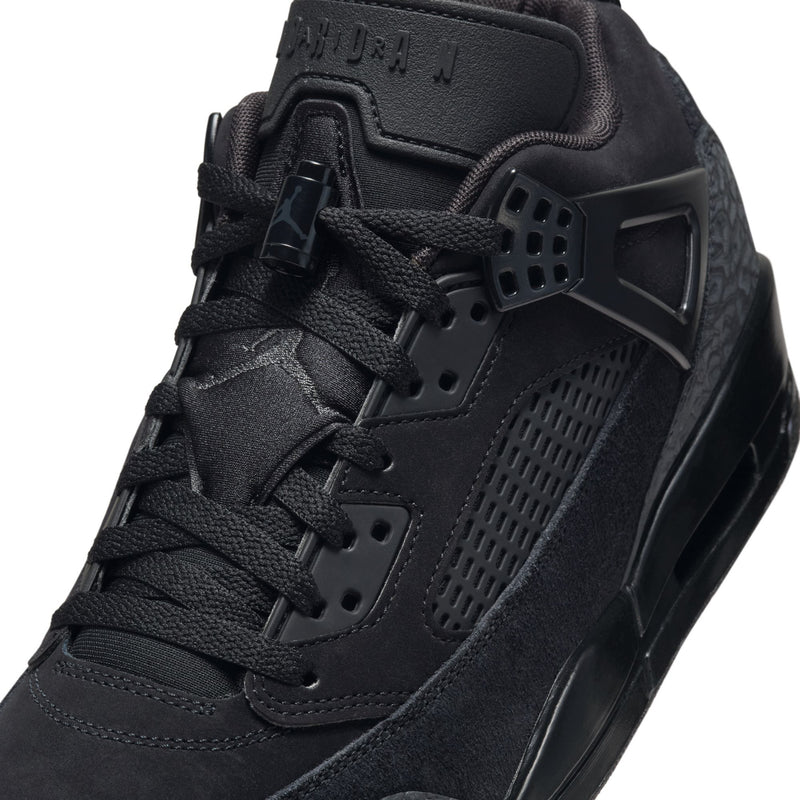 Black low-top sneaker upper with lace-up, perforated panels, and molded side cage