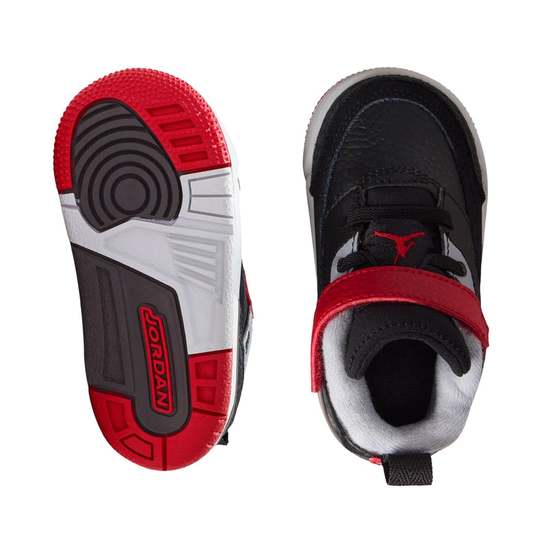 Toddler sneaker outsoles with red heel and black tread, cushioned white sole
