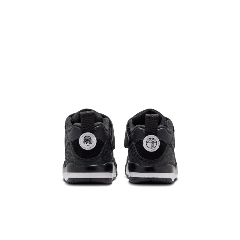Black toddler sneakers, heel view with circular back emblem and padded collar