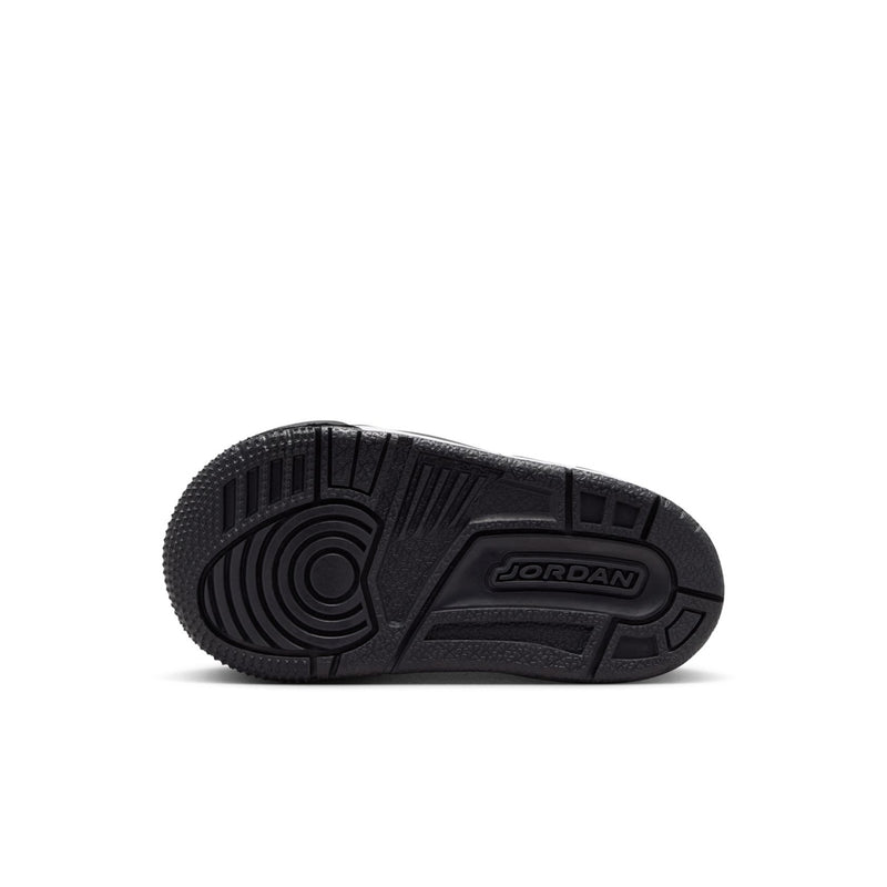Black outsole with tread pattern and Jordan logo on toddler sneaker