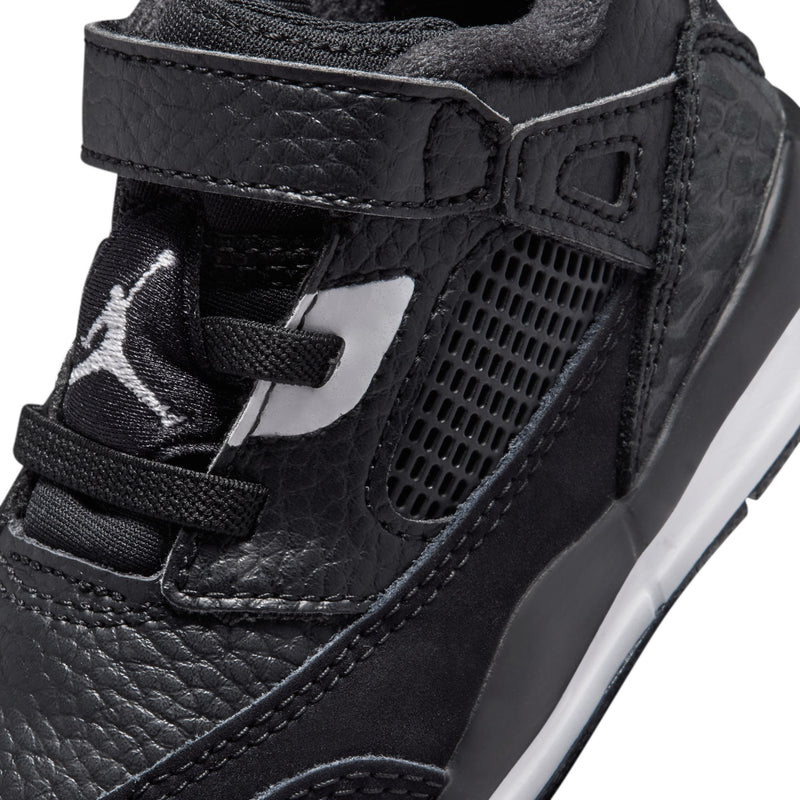 Black toddler sneaker upper close-up with mesh panel, strap, and white logo