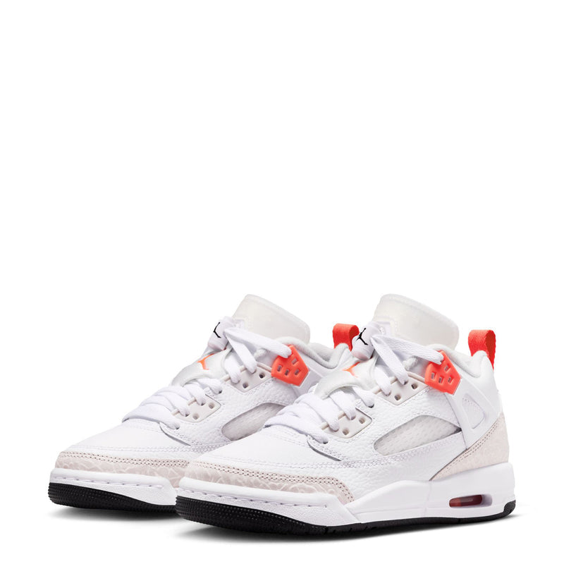 Pair of youth white low-top sneakers with bright crimson lace and logo accents