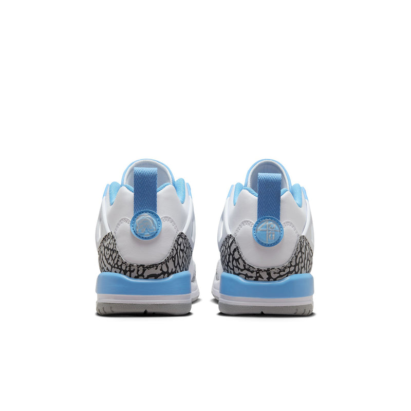 Youth low-top sneakers heel view: white leather with blue heel tabs and speckled panel