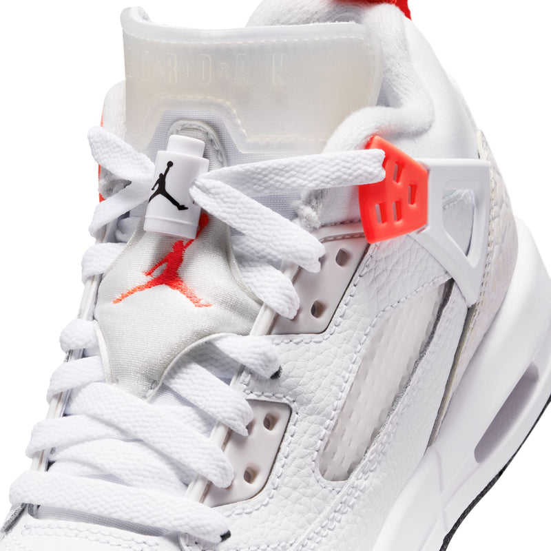 Close-up of youth white sneaker upper with laces, gray panel, and red lace lock