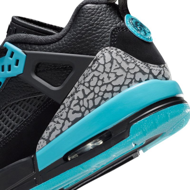 Youth low-top sneaker close-up, speckled toe and turquoise air-window outsole detail