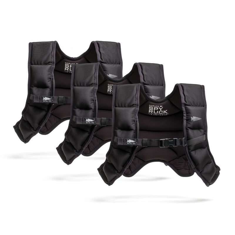 Three black Spy Ruck Bundle weighted vests with adjustable straps, including a women’s Weighted Vest, are arranged in a row on a white background.