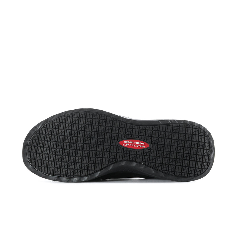 Men's black slip-on sneakers outsole with textured tread and red logo patch