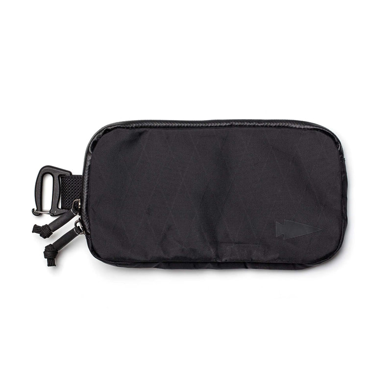 The Sternum Pouch - X-PAC is a black pouch featuring a carabiner clip, dual zipper pulls, and an arrow logo on the bottom right corner.