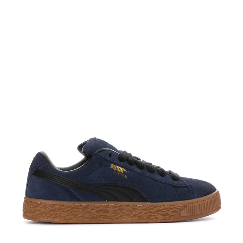 Men's navy suede sneakers with gum outsole, lace-up, PUMA logo on side