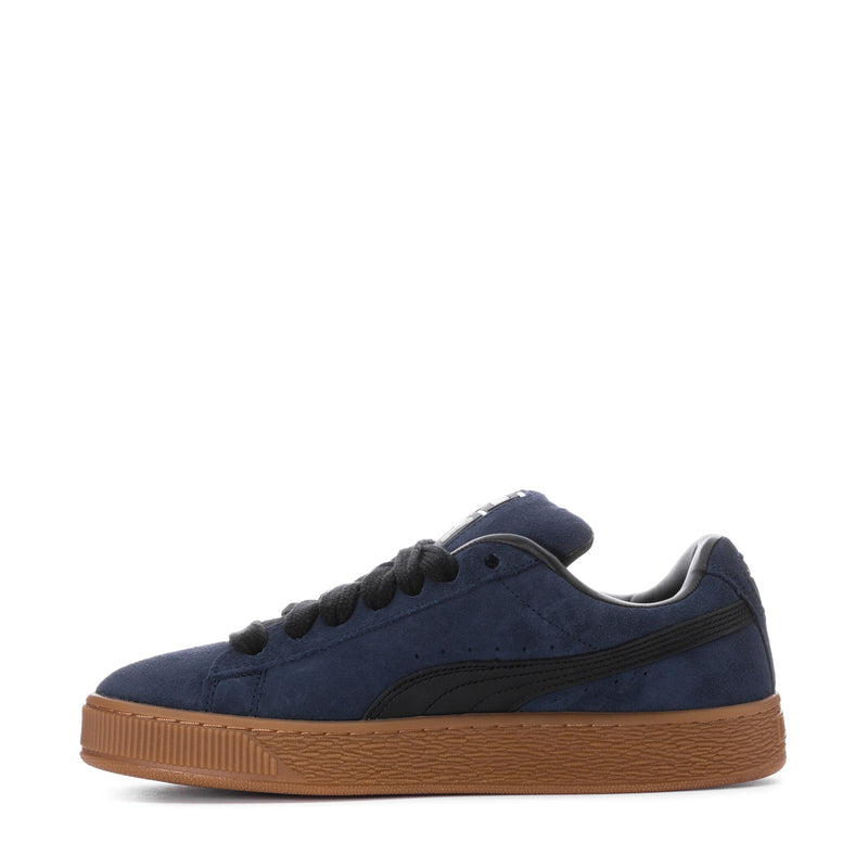 Men's navy suede lace-up sneakers with gum sole, side profile view