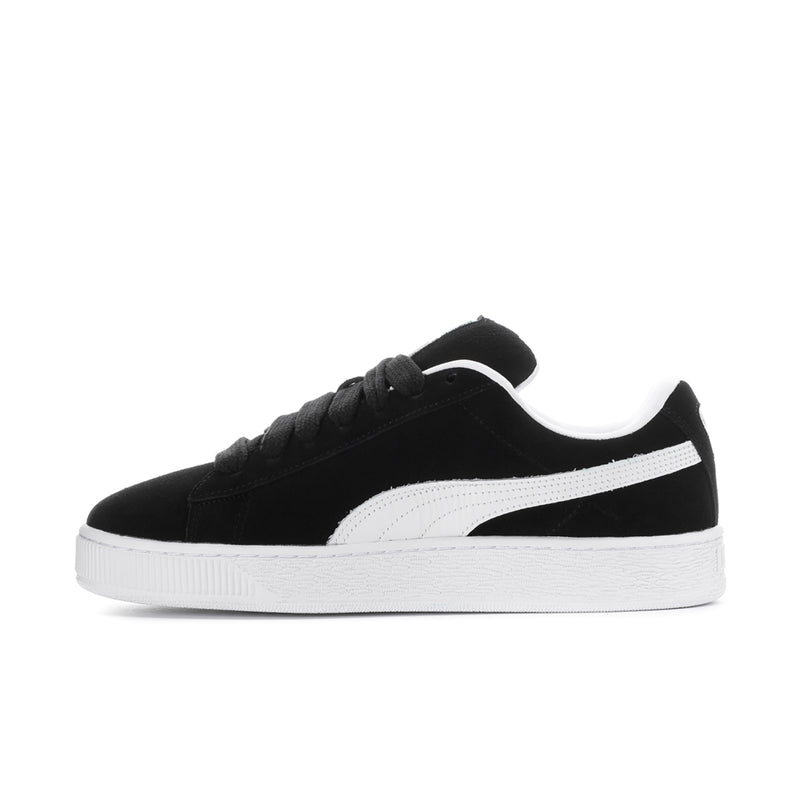 Black suede low-top sneakers with white side stripe and white rubber sole