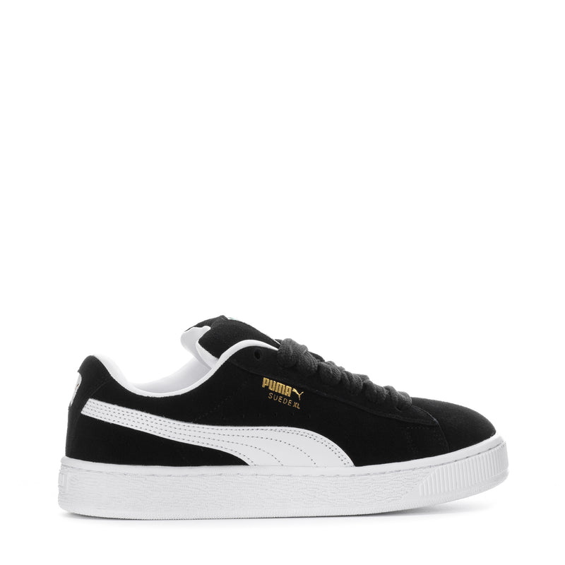 Black suede youth sneakers with white side stripe and textured white sole