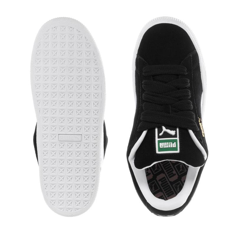 Black suede youth sneakers with white outsole bottom and black lace-up upper