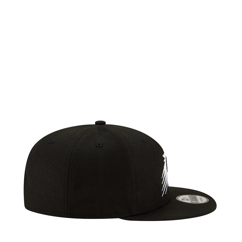 Black baseball cap, side view with partial white emblem and flat brim