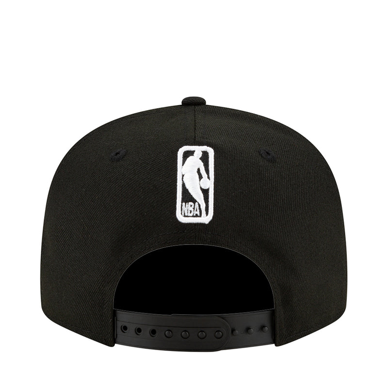 Black baseball cap with white NBA logo patch on front
