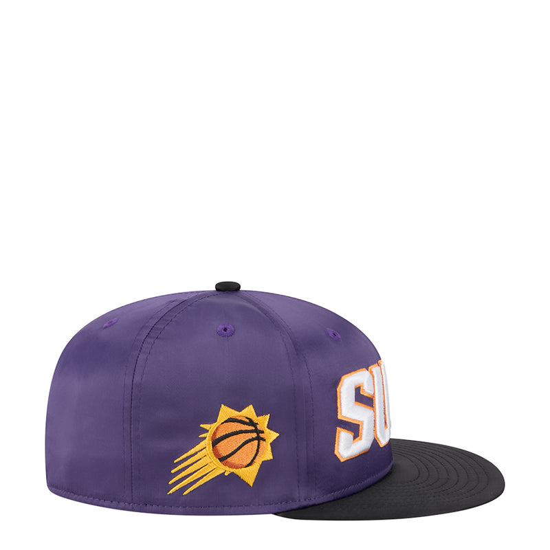 Two-tone basketball cap in purple with black brim, side view with team logo and SUNS letter