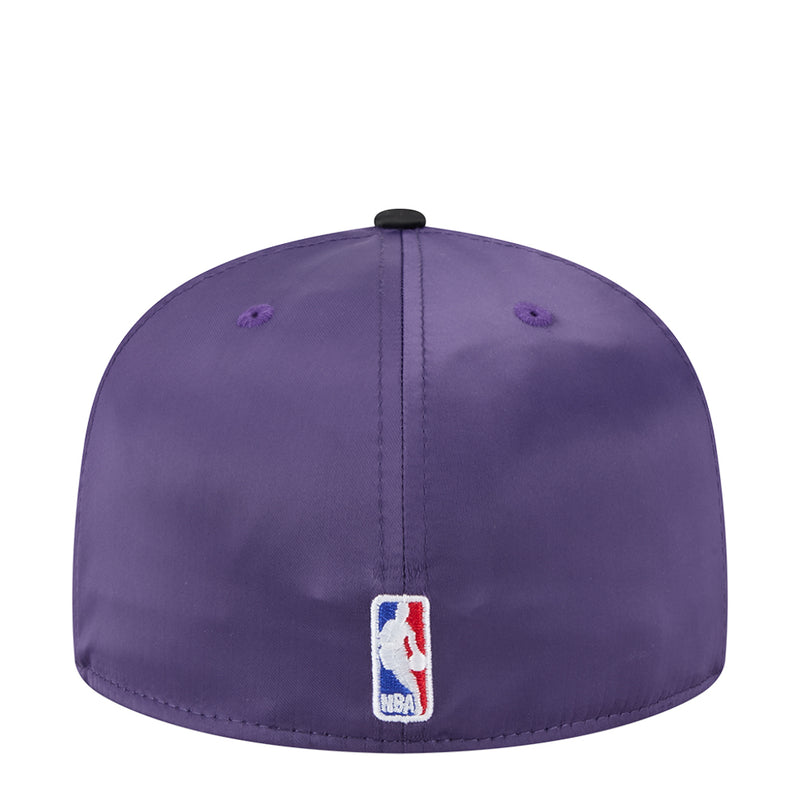 Two-tone basketball cap in purple with black brim, NBA patch on back panel