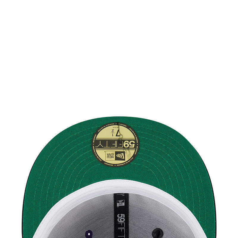 Two-tone baseball cap with green crown, light gray panel, and white brim