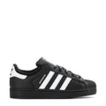 Kids black/white Adidas Superstar II sneakers, side view with stripes and laces