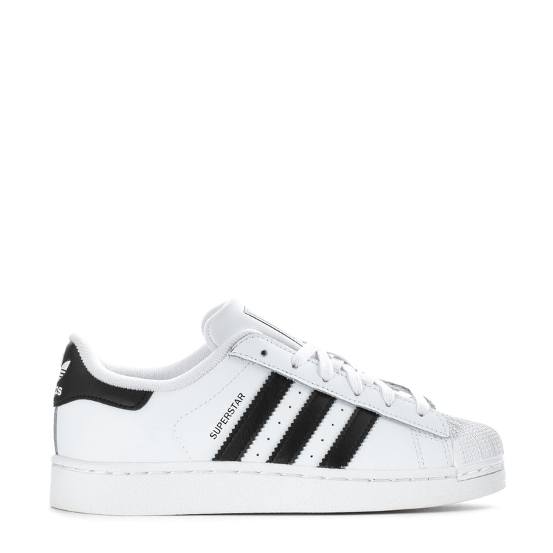 Kids' adidas low-top sneakers, white upper with black three-stripe panels and lace-up closure