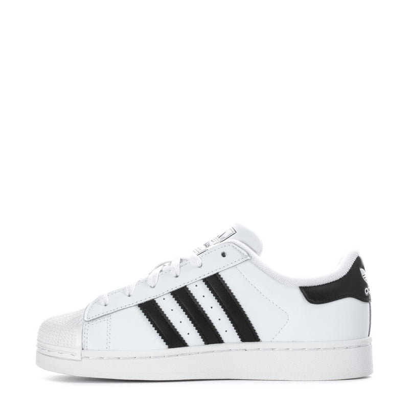 Kids' adidas low-top sneakers, side view with black stripe accents and white lace-up upper